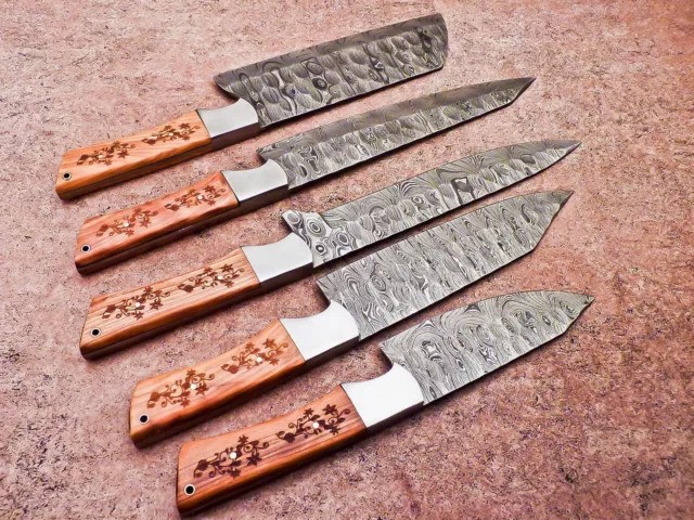 Forged in Fire style Damascus chef knives used in outdoor cooking