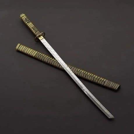 Handmade Damascus katana resting in wooden saya sheath