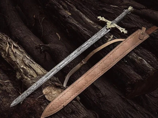 Hardwood handle and forged steel guard of a handmade Templar sword